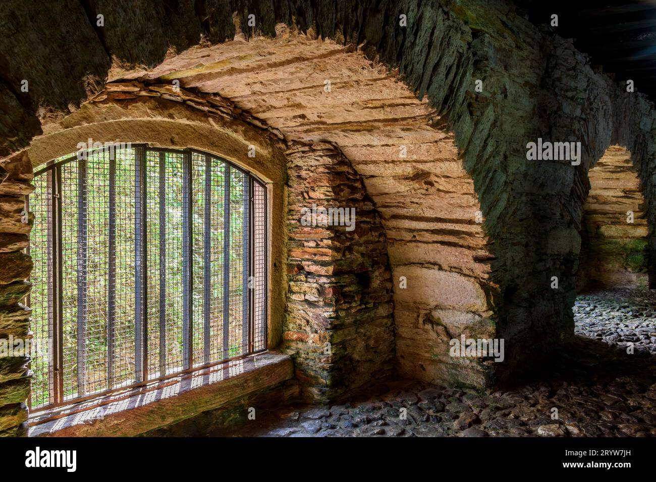 Bars and windows of underground Senzala used to imprison slaves Stock Photo
