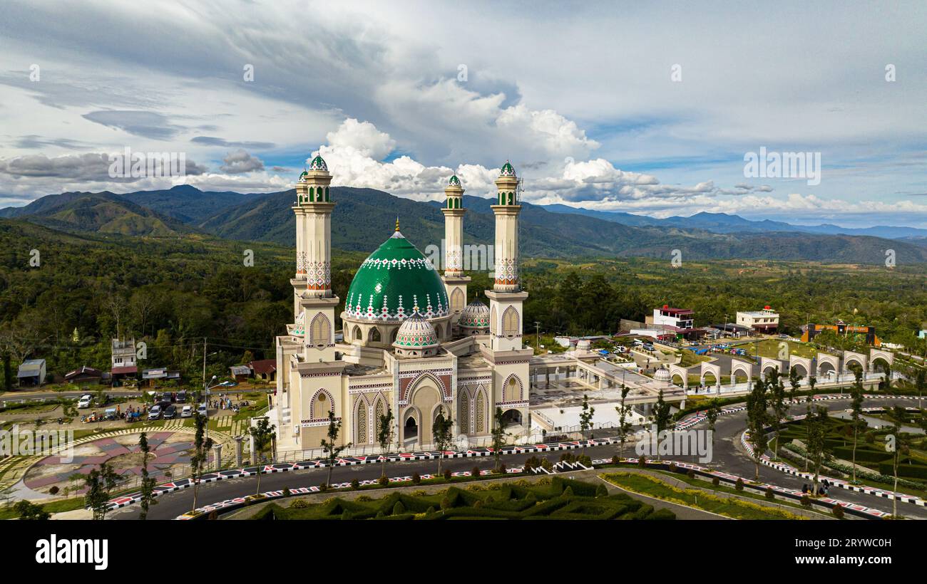 A beautiful mosque in the background of the mountains. Masjid Agung Syahrun Nur Tapanuli Selatan. Indonesia. Stock Photo