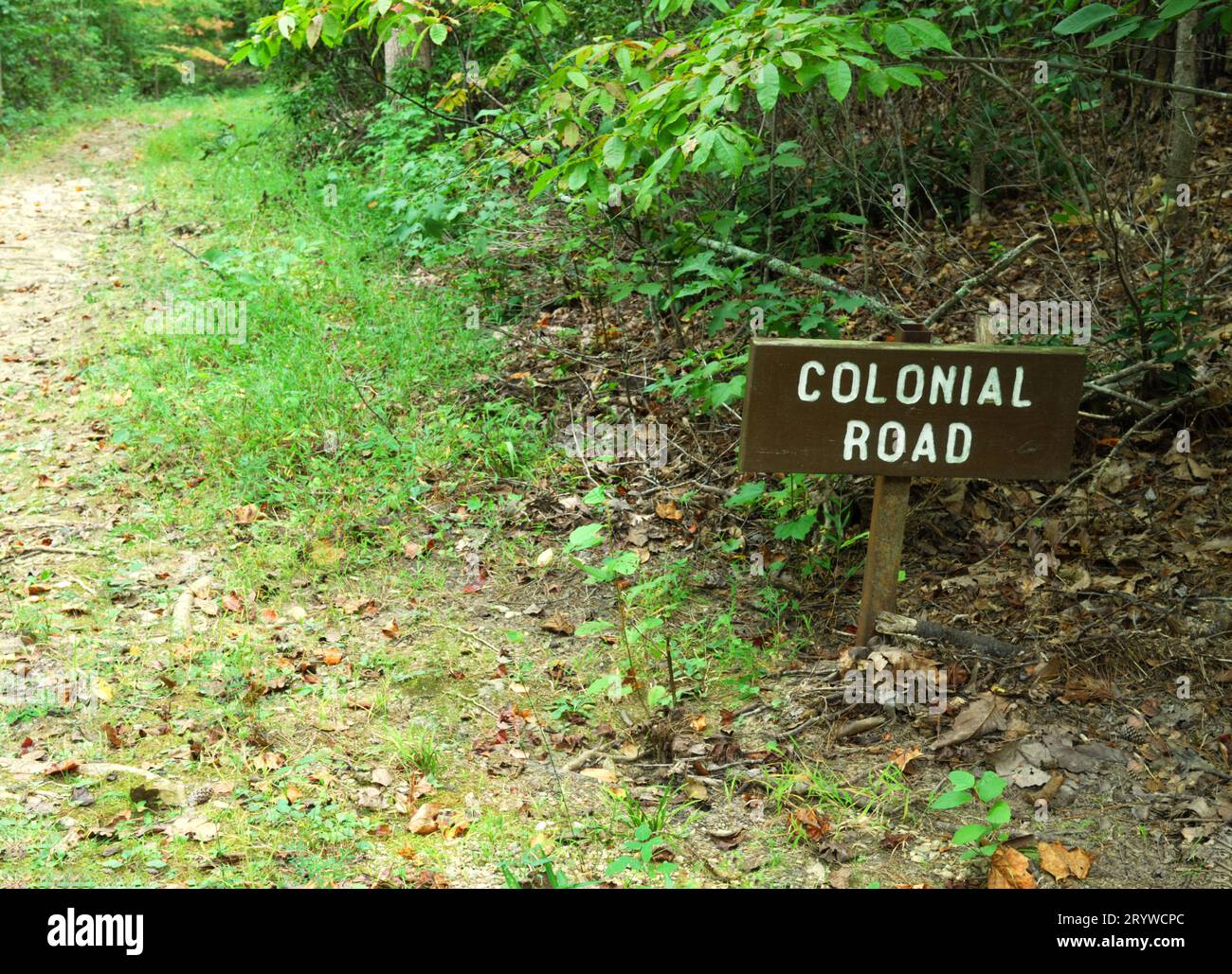 Photo shows Colonial Road sign beside hiking trail at the Kings Mountain National Military Park, South Carolina USA. Stock Photo