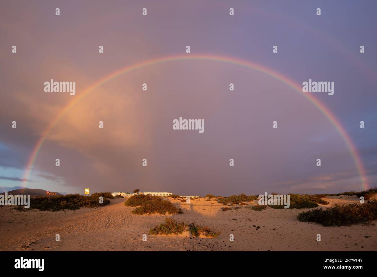 Enchanting Rainbows at the Outskirts of Corralejo at Sunrise Stock Photo