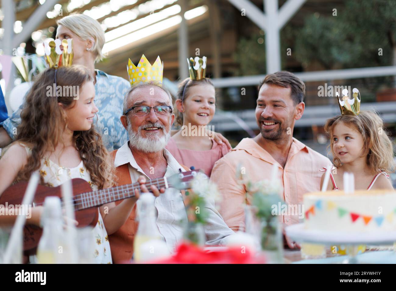 Family having birthday garden party. Stock Photo