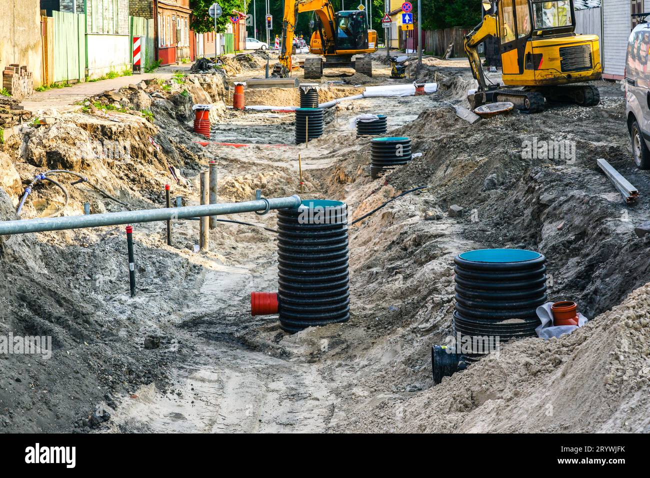 Street reconstruction view with a wide trench, replaced sewer and water ...