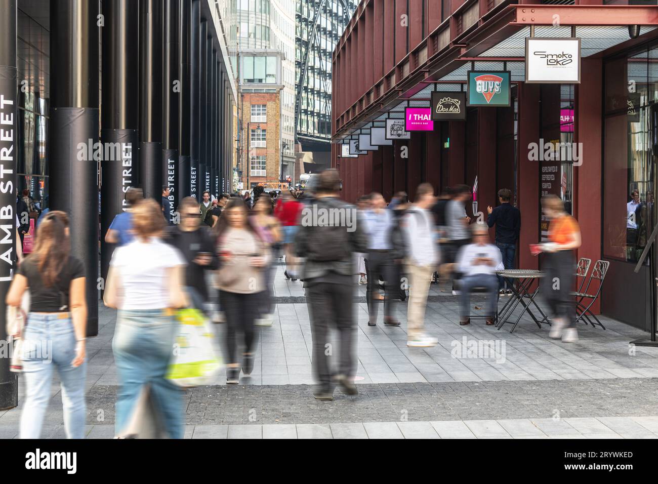 Crowds of people and restaurant outlets in Lamb St, Spitalfields, London E1. Stock Photo