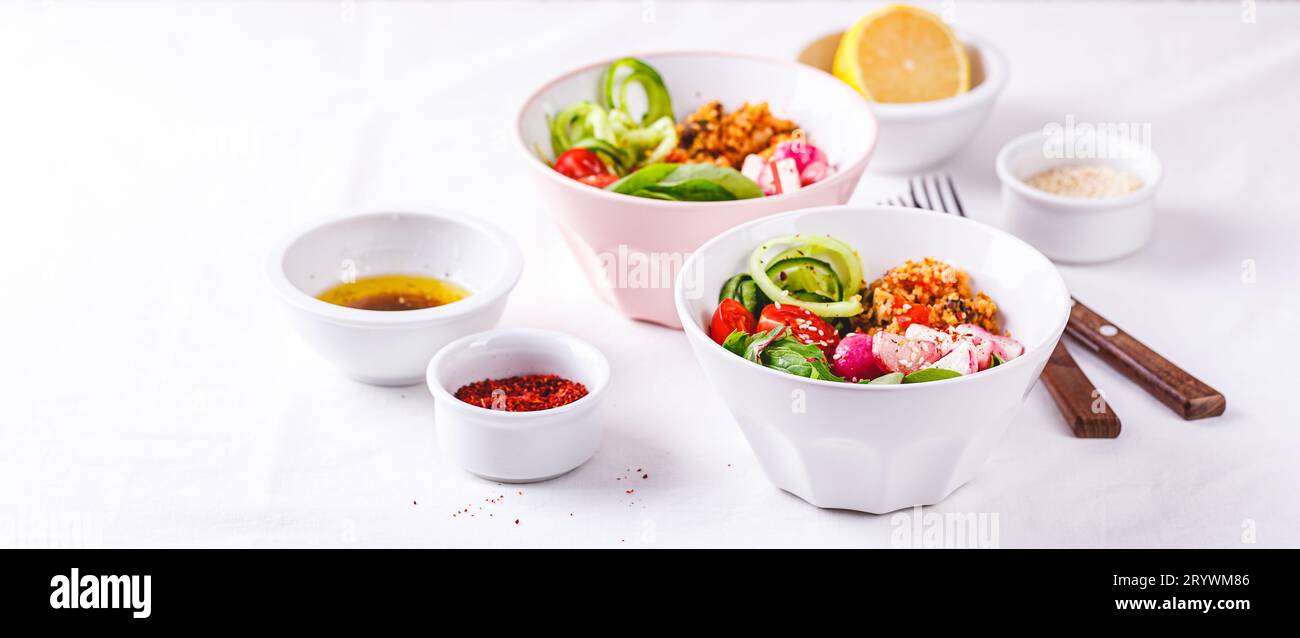 Fresh salad with couscous, tomatoes, cucumber, radish and chard. Stock Photo
