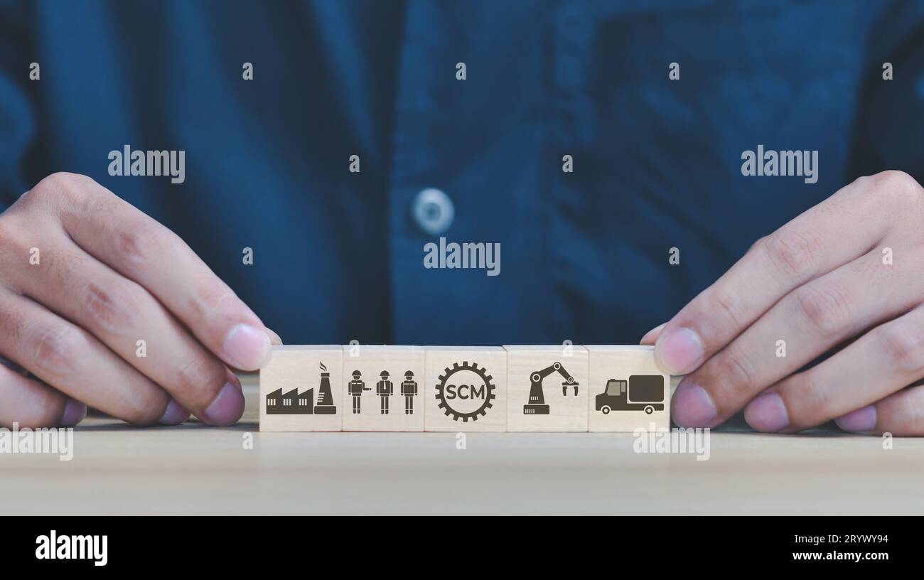 Supply Chain Management - SCM concept with icon on wooden cube stack.Global company network Stock Photo