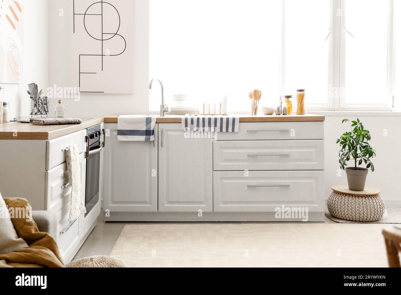 Interior of light kitchen with white counters and soft carpet Stock ...