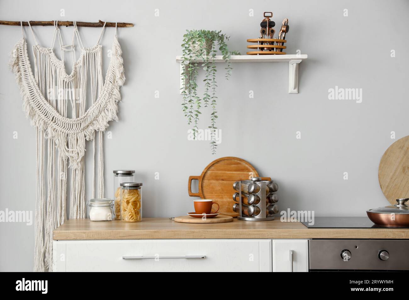 Interior of light kitchen with counter and shelf Stock Photo - Alamy
