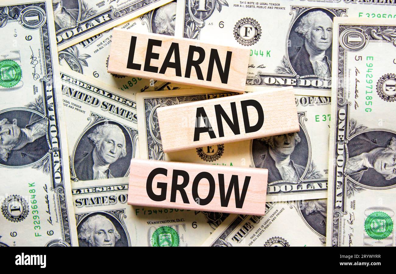 Learn and grow symbol. Concept word Learn And Grow on beautiful wooden ...
