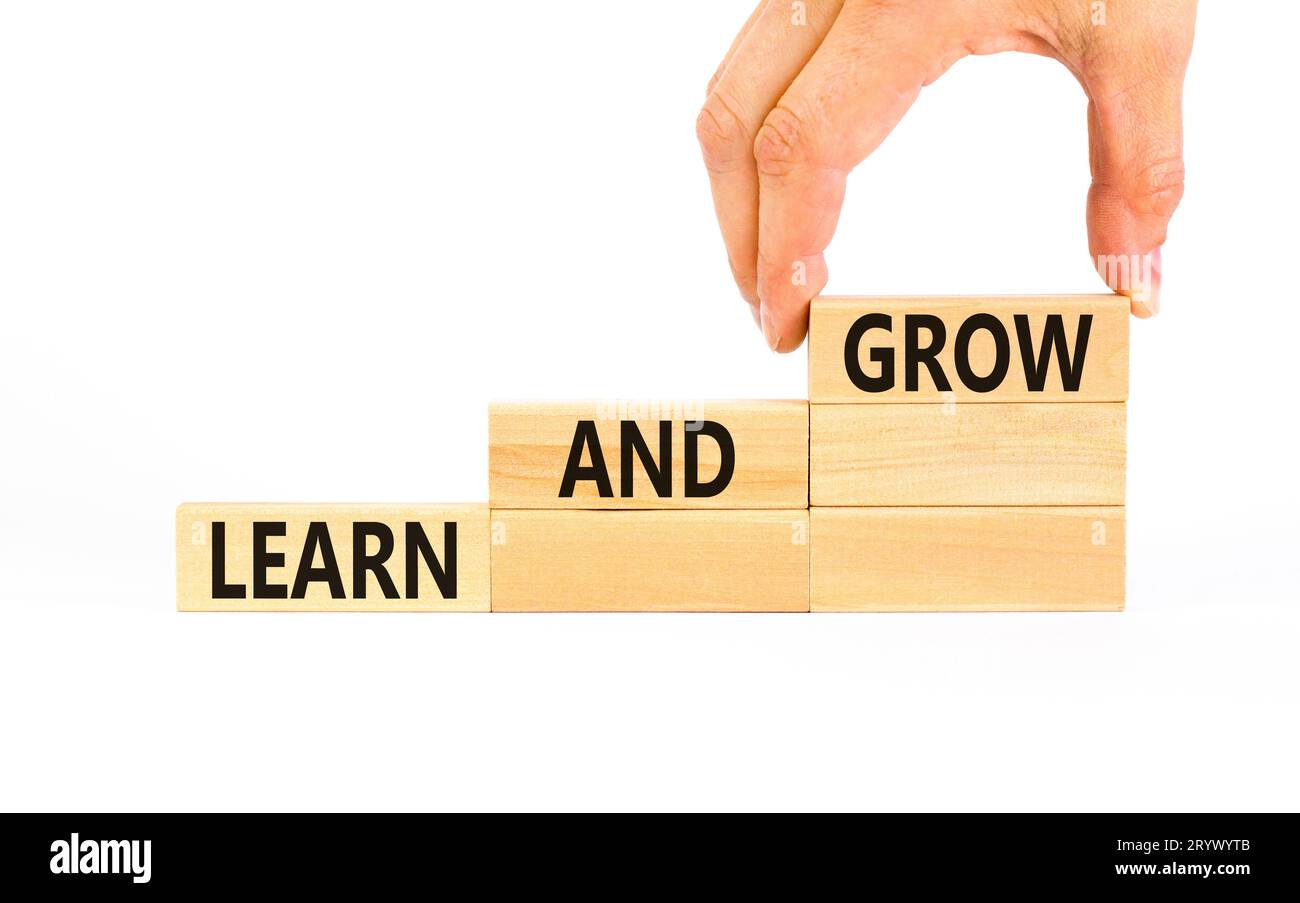 Learn and grow symbol. Concept word Learn And Grow on beautiful wooden ...