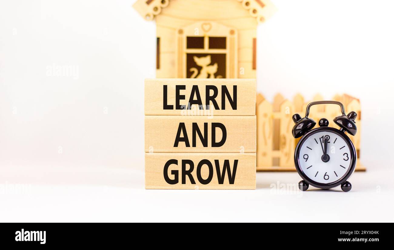 Learn and grow symbol. Concept word Learn And Grow on beautiful wooden ...