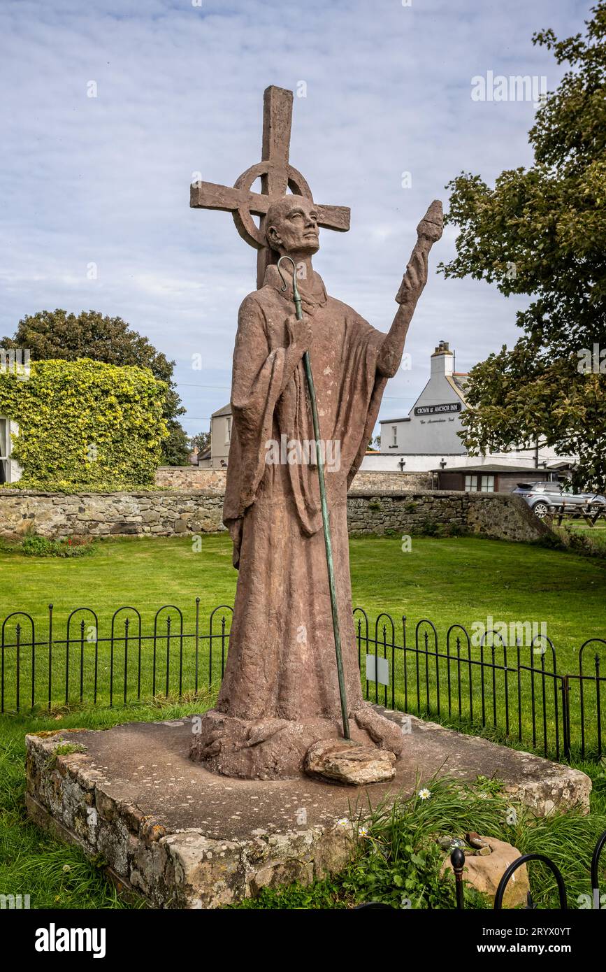 Statue of Saint Aidan in the grounds of Lindisfane Priory on Holy Island, Northumberland, UK on 22 September 2023 Stock Photo