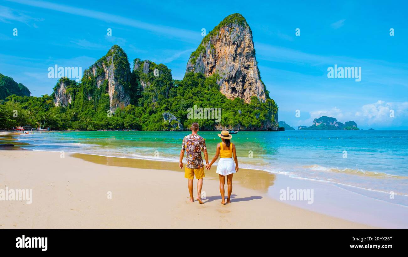 Railay Beach Krabi Thailand, a couple of men and woman on the