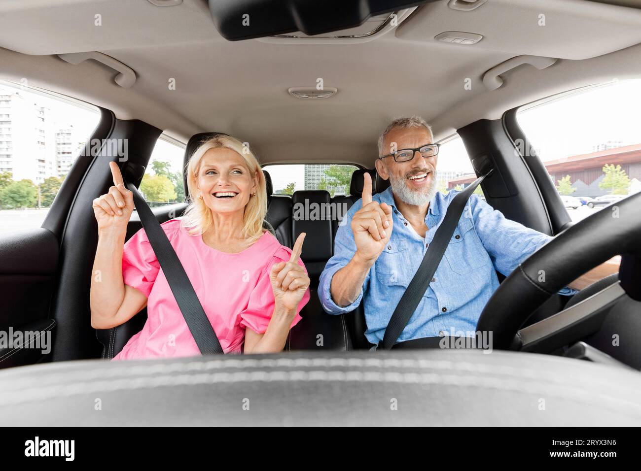 Woman driving car dancing enjoy hi-res stock photography and images - Alamy
