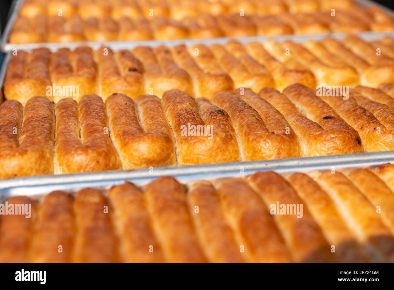 Balkans pastry borek on display in a bakery , Turkish Tepsi Boregi, Round Borek, Tray pastry. High quality photo Stock Photo