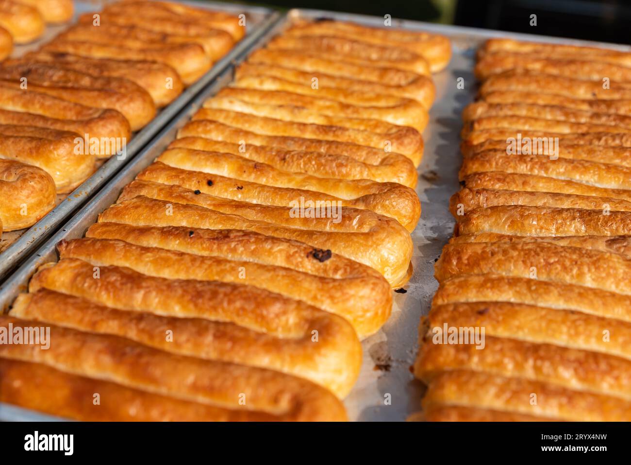 Balkans pastry borek on display in a bakery , Turkish Tepsi Boregi, Round Borek, Tray pastry. High quality photo Stock Photo