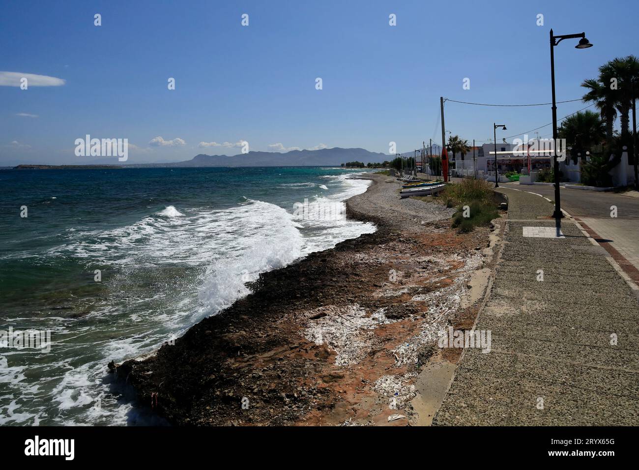 Rough sea on the coast between Megalochori and Skala villages, Agistri island, Saronic island group, Greece. Taken May 2023 Stock Photo