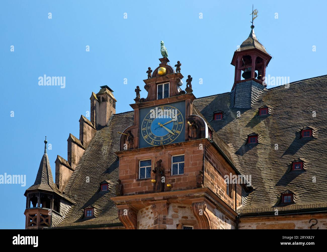 Renaissance gable from 1581 with the art clock on the stair tower, town ...