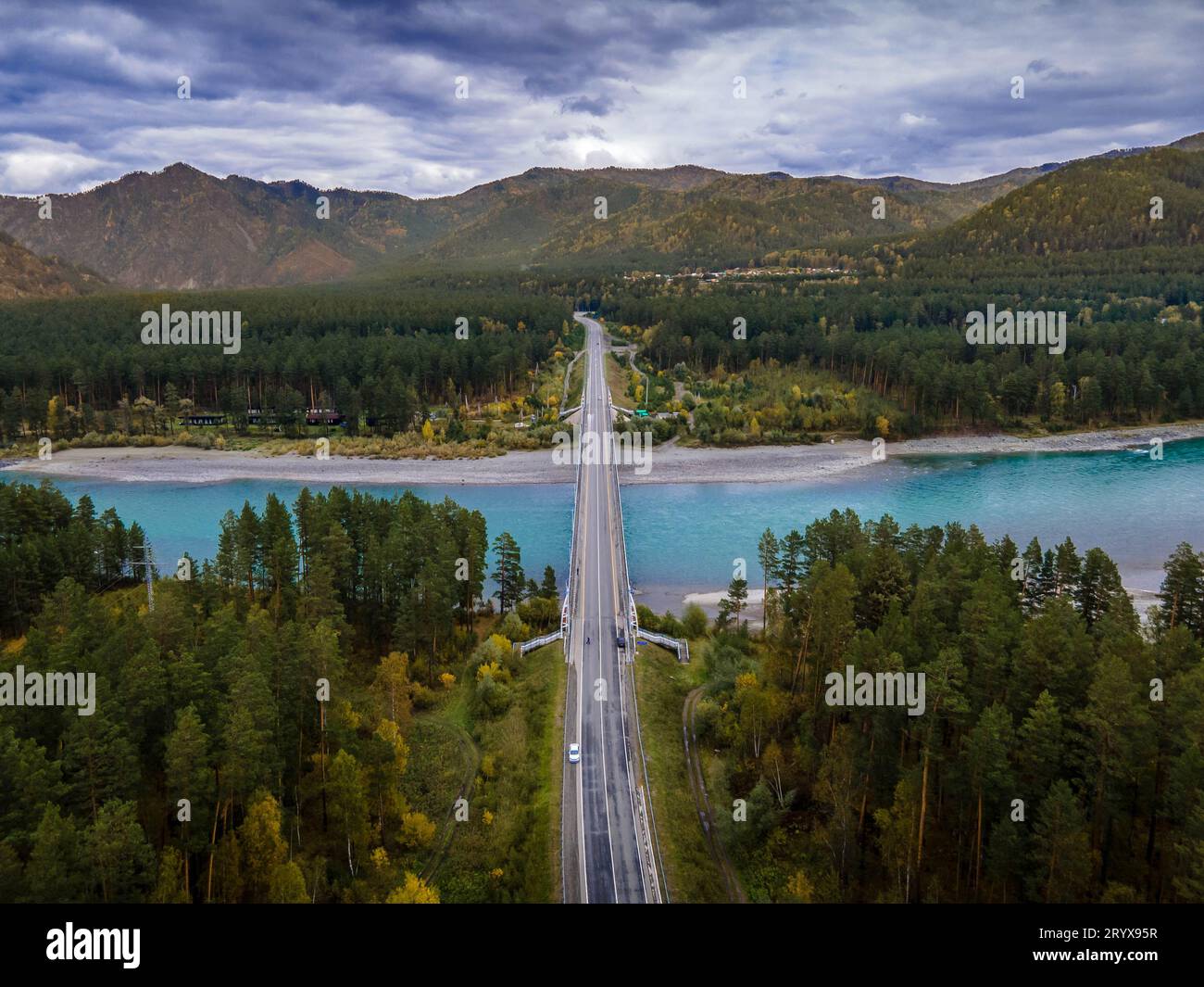 The car bridge across the Katun river in the Altai mountains in Siberia, Russia (aerial photo). Stock Photo