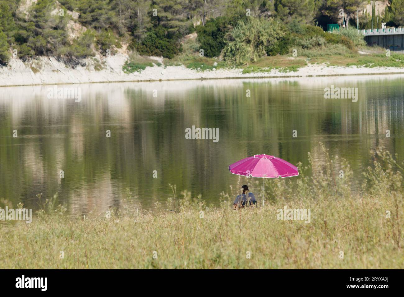 Fishing umbrella at river or lake beach Stock Photo - Alamy