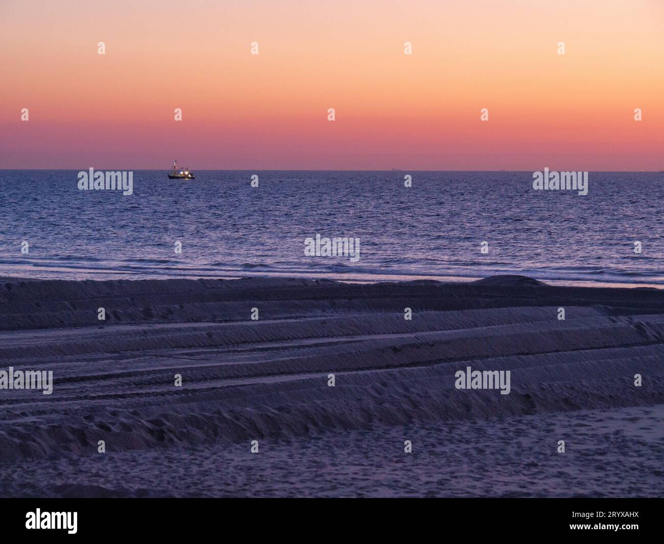 Sundown at de haan beach Stock Photo