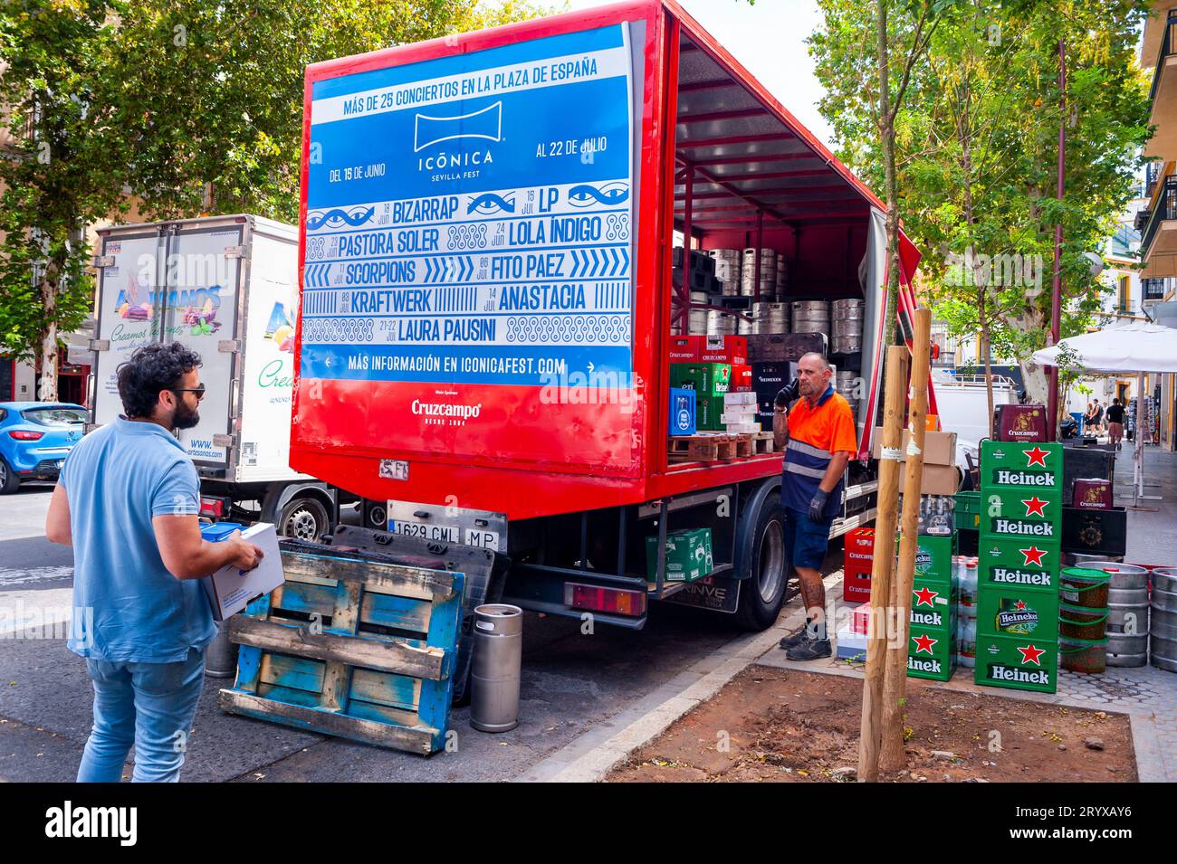 Seville Spain, Two Men, Delivery WOrkers on Street, Delivering Beer, from Truck, in Old Town Center, Stock Photo
