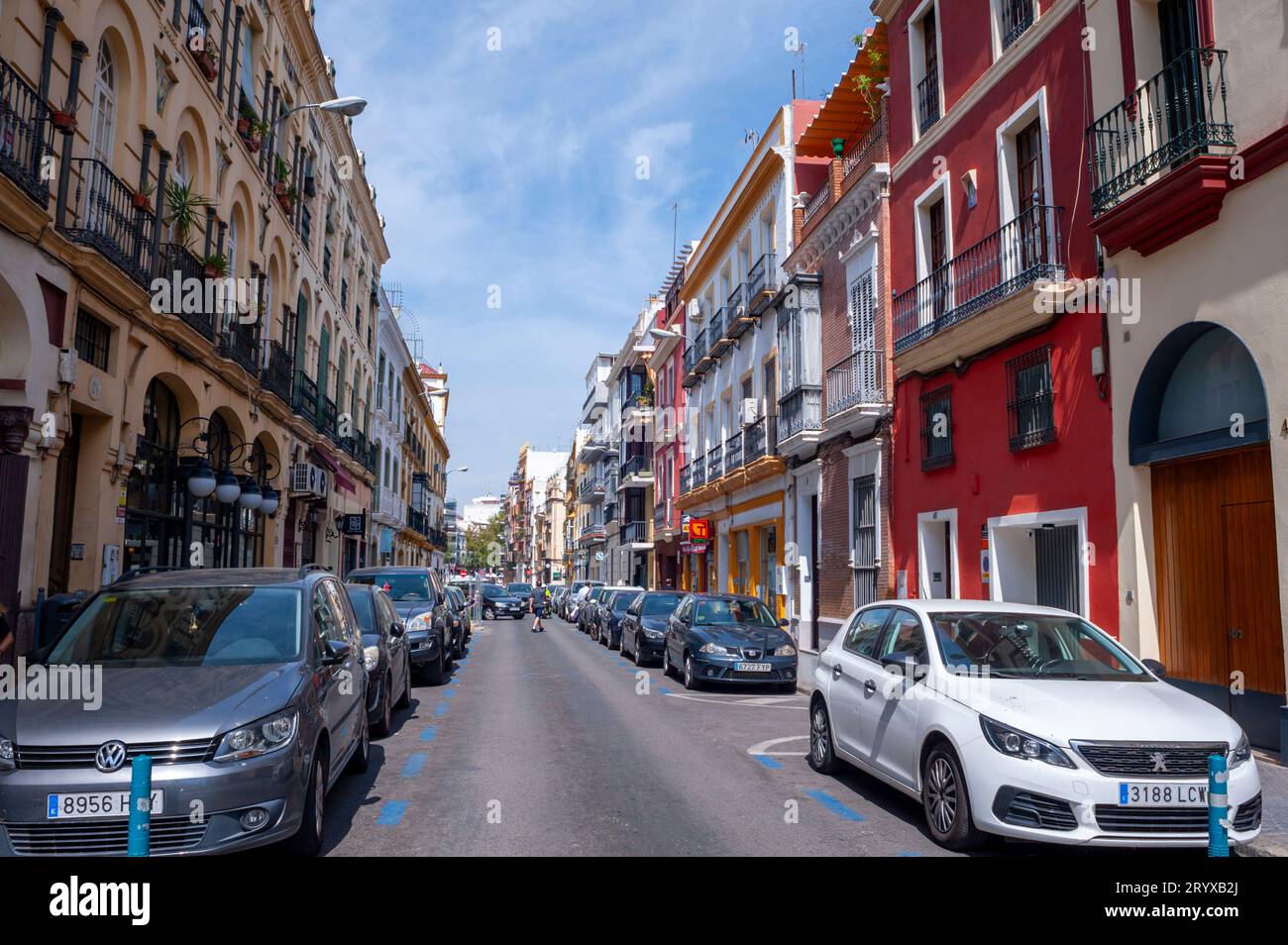 Seville Spain, Wide Angle View, Street Scene, Apartment Buildings, in Old Town Center, Parked Cars, facades Stock Photo