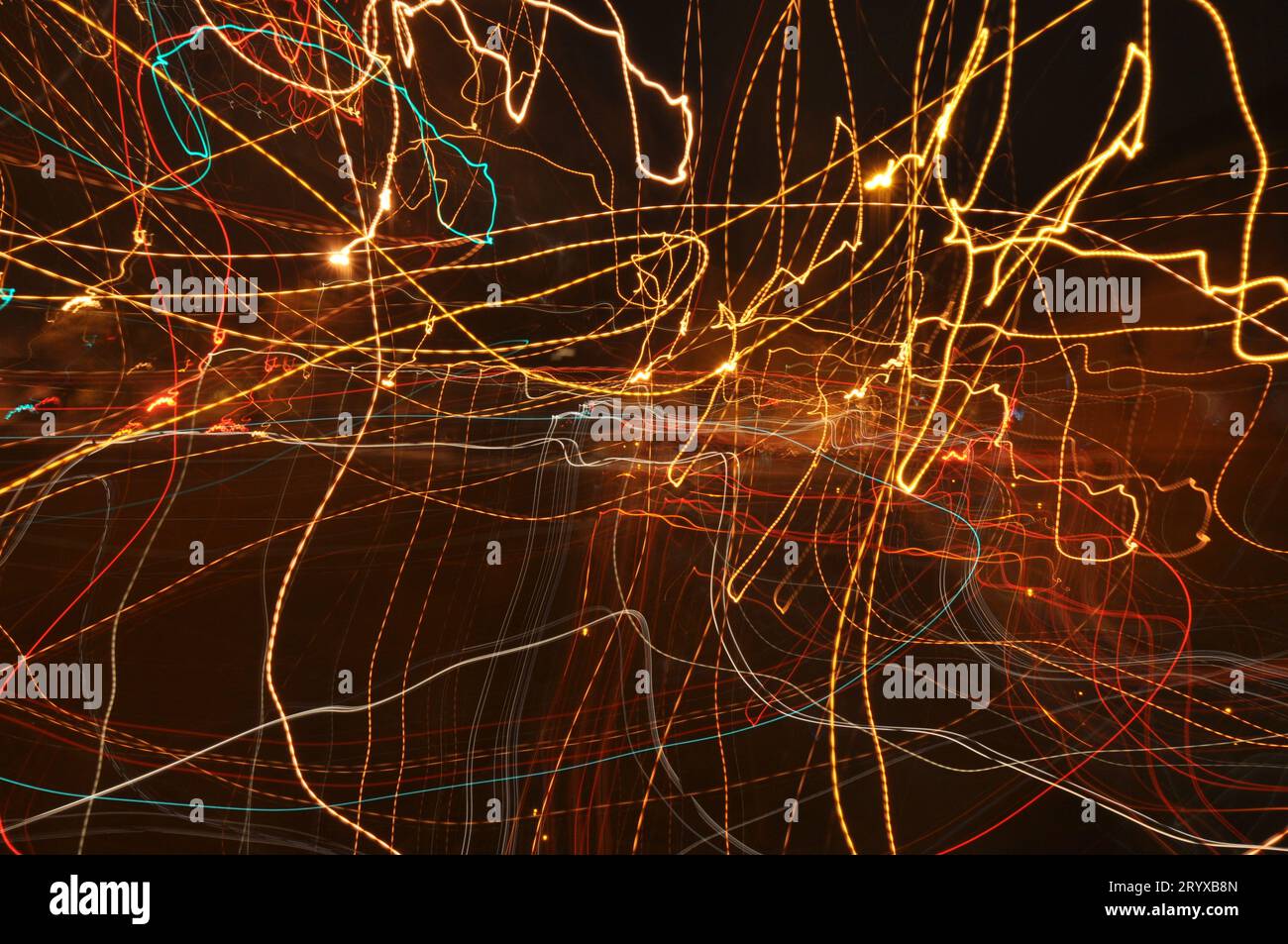 3D rendering of abstract light painting in the style of fireflies in yellow, red, green, and orange Stock Photo