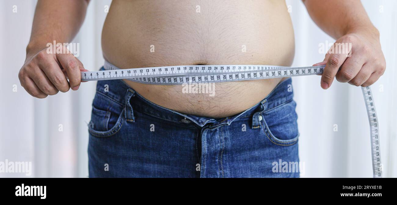 https://c8.alamy.com/comp/2RYXE1B/man-with-fat-belly-in-dieting-concept-overweight-man-touching-his-fat-belly-and-want-to-lose-weight-2RYXE1B.jpg