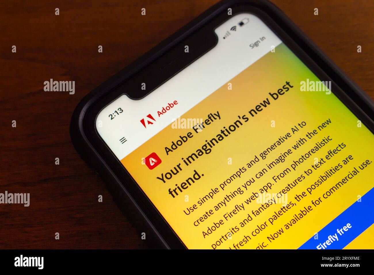 Website of Adobe Firefly seen in iPhone screen. Adobe Firefly is a product of Adobe Creative Cloud and a generative machine learning model for design Stock Photo