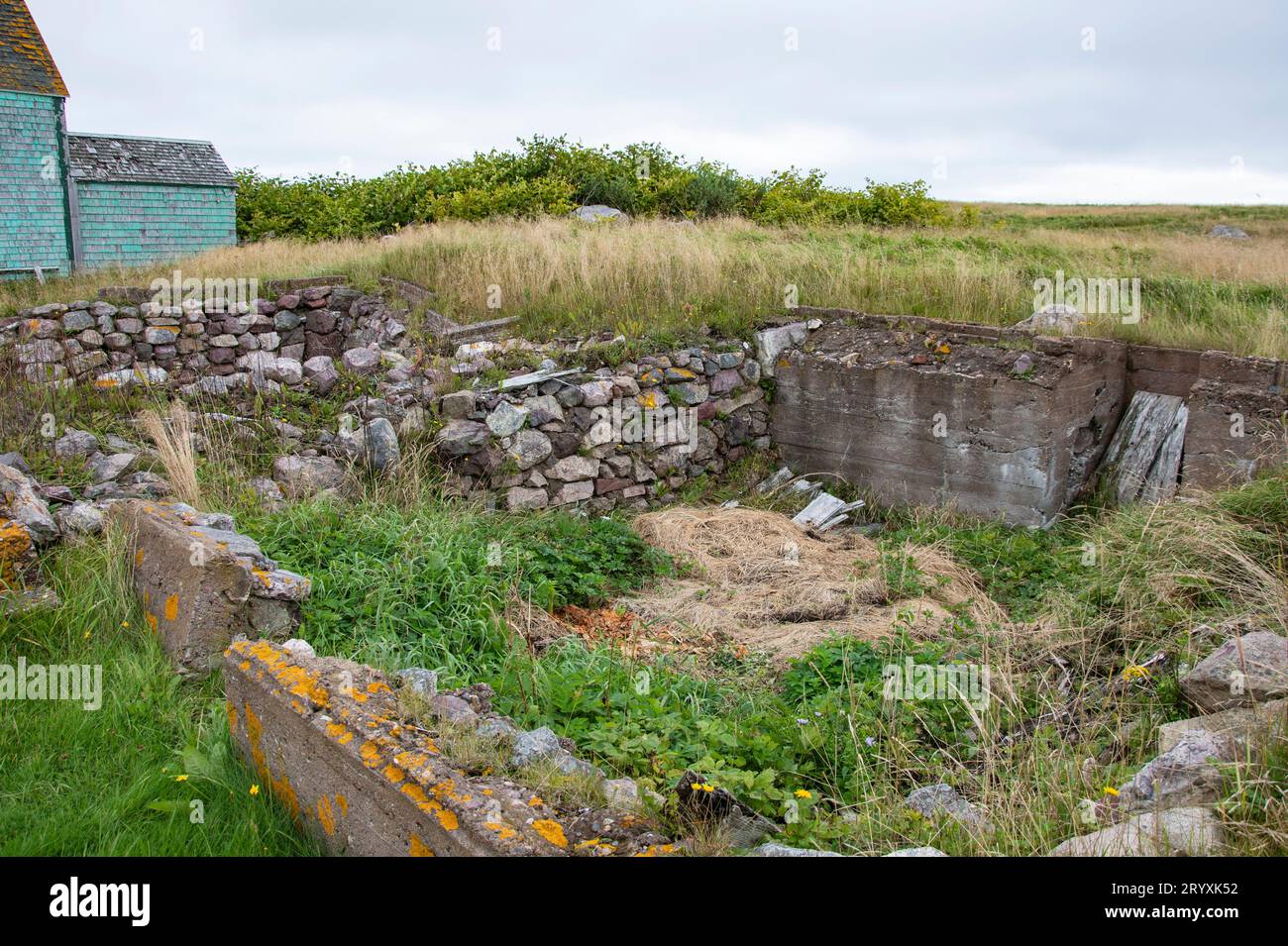 Remains of stone foundations on Ile-aux-Marins in St. Pierre, France Stock Photo