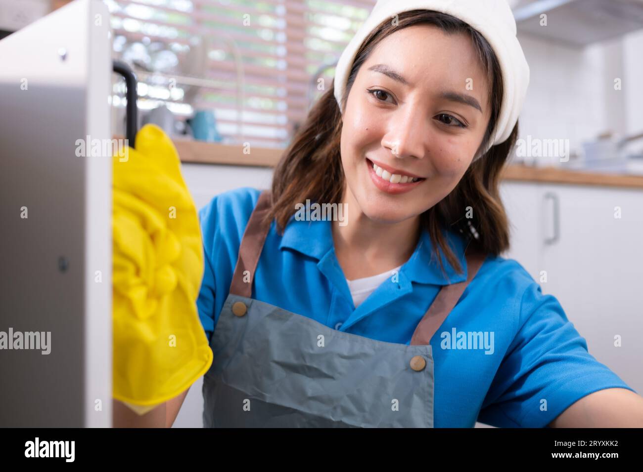 Woman in apron rubber gloves hi-res stock photography and images - Alamy