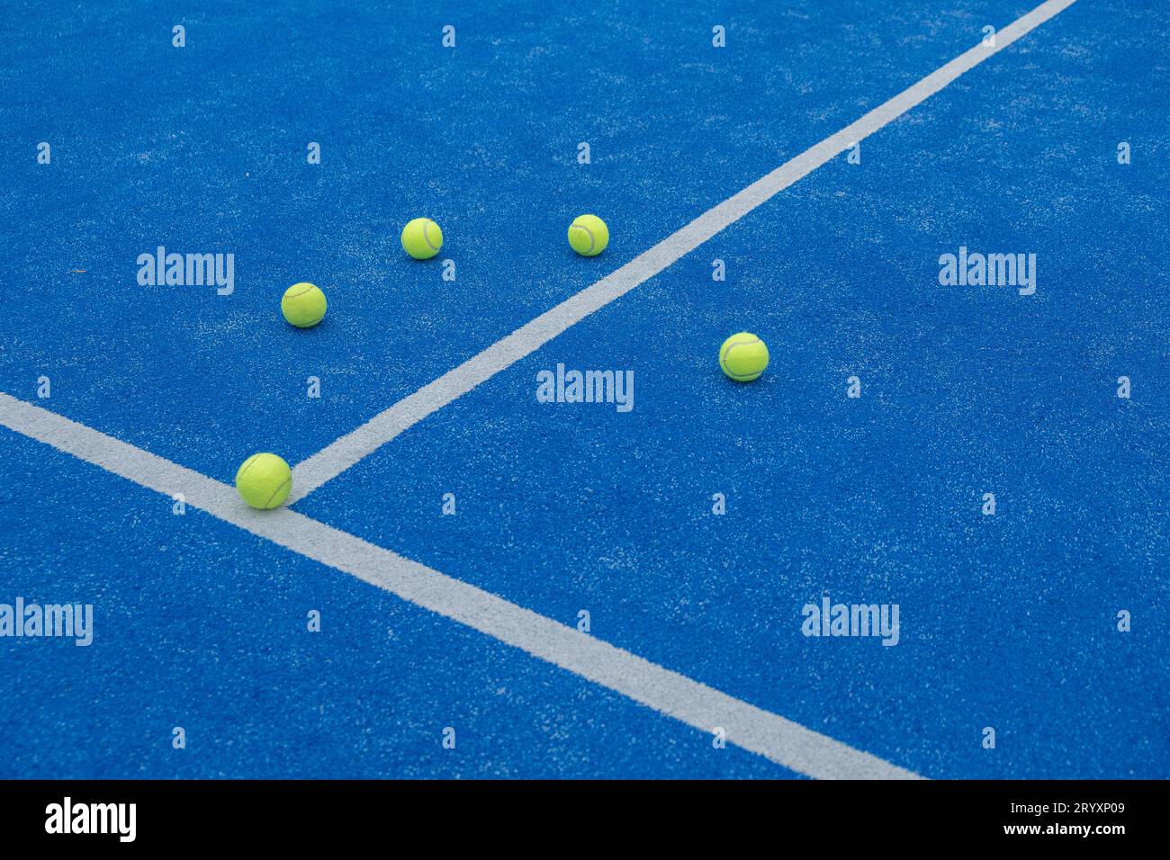 selective focus, five balls on a paddle tennis court Stock Photo