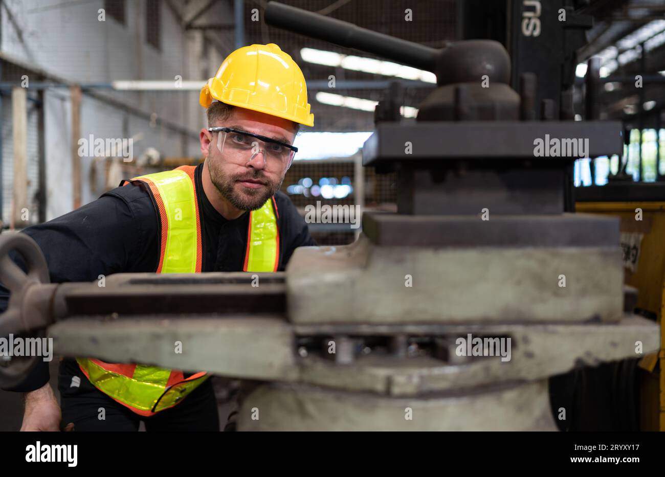 Mechanical engineers enter the old machinery warehouse to inspect and