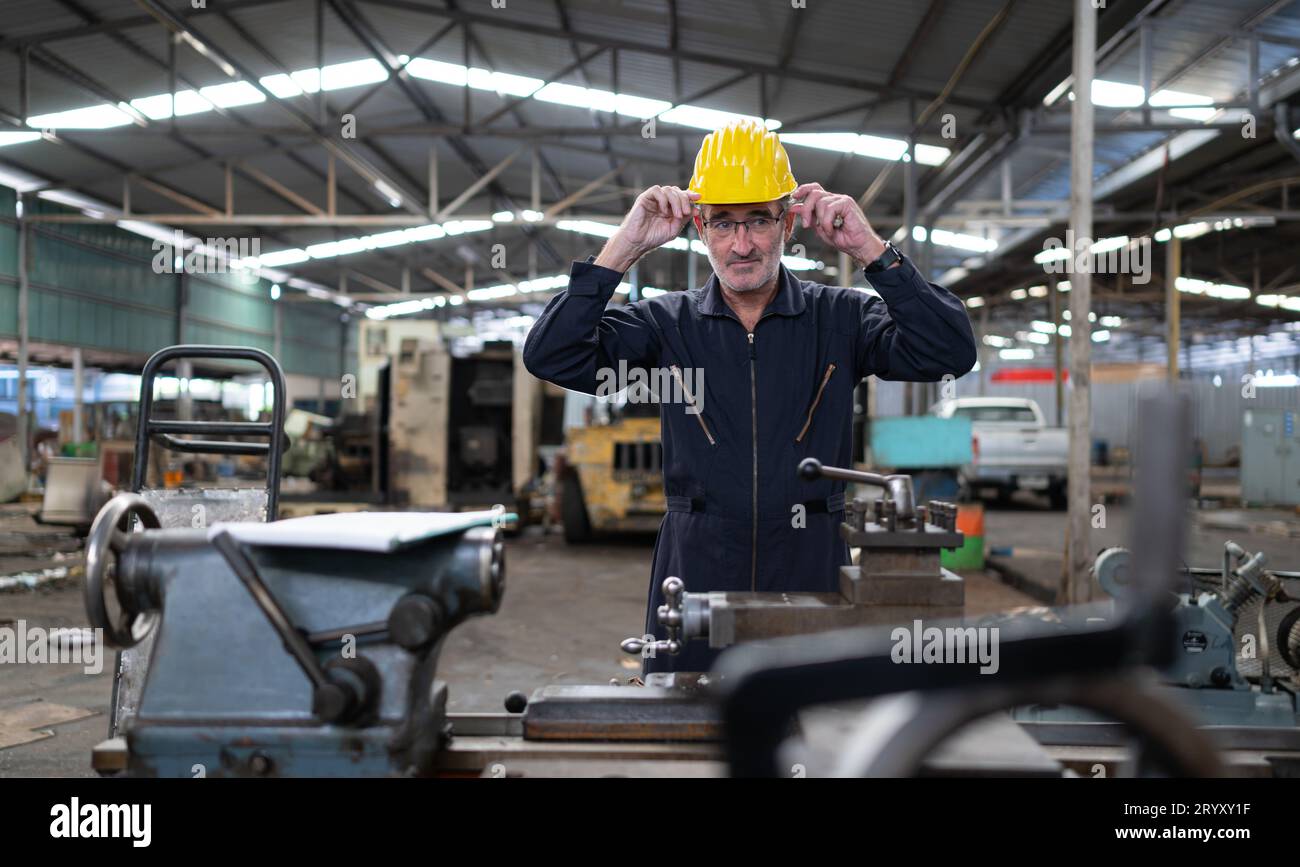 Senior engineer with fatigue from long and hard work Stock Photo