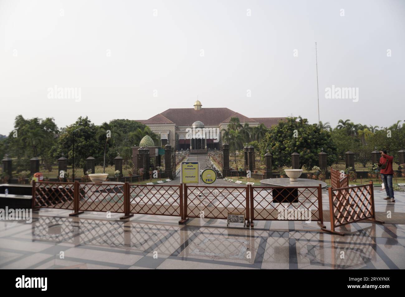 Depok, West Java. October 1, 2023 - beautiful building with an outside yard and an iron fence away from the building door. Stock Photo