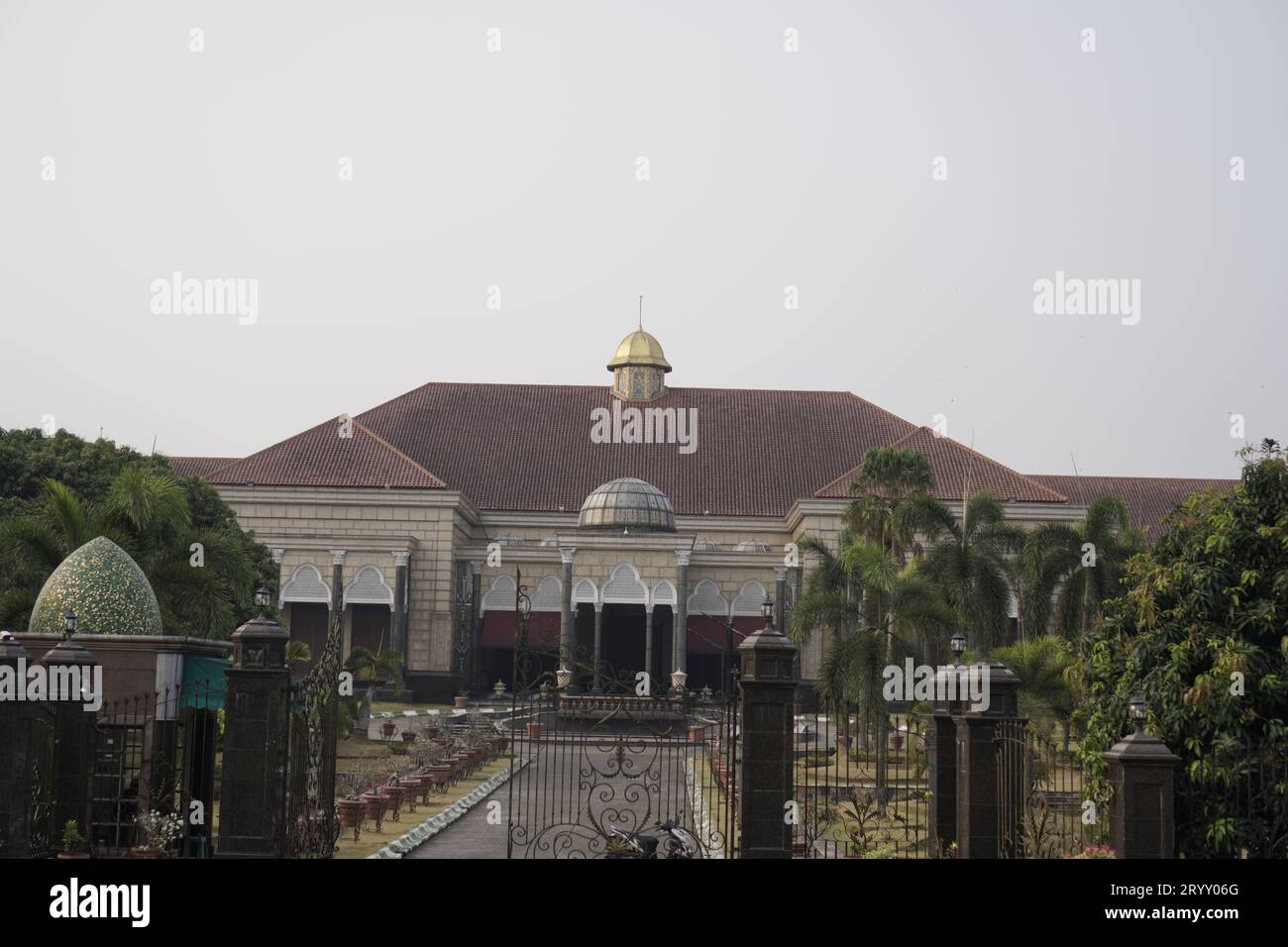 Depok, West Java. October 1, 2023 - beautiful building with an outside yard and an iron fence away from the building door. Stock Photo