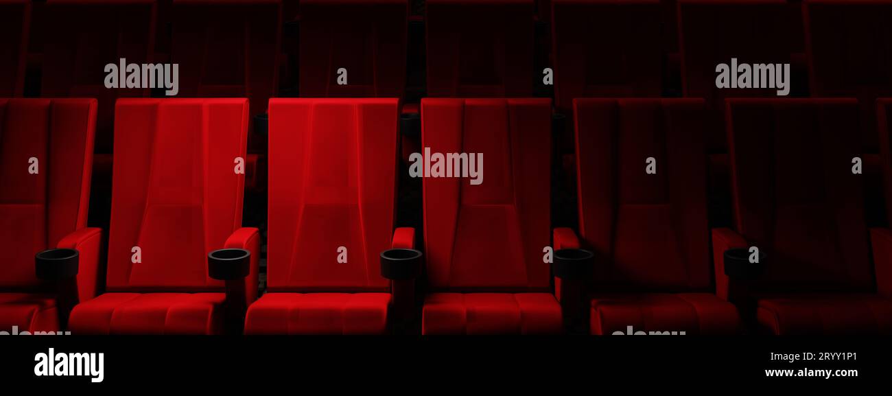 Rows of red velvet seats watching movies in the cinema with spotlight only couple deluxe seat background. Entertainment and Thea Stock Photo