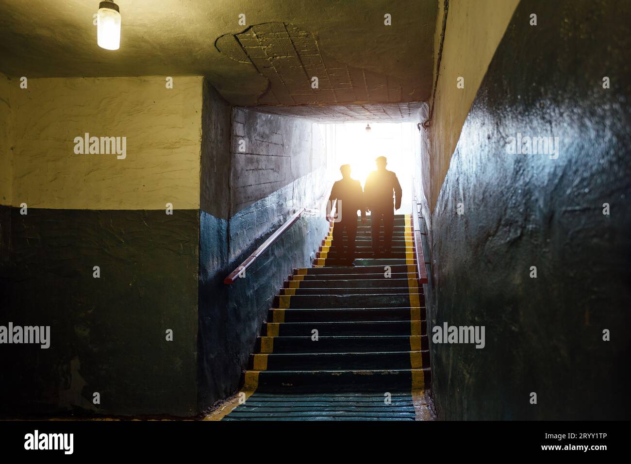 People entering to bomb shelter. Stock Photo