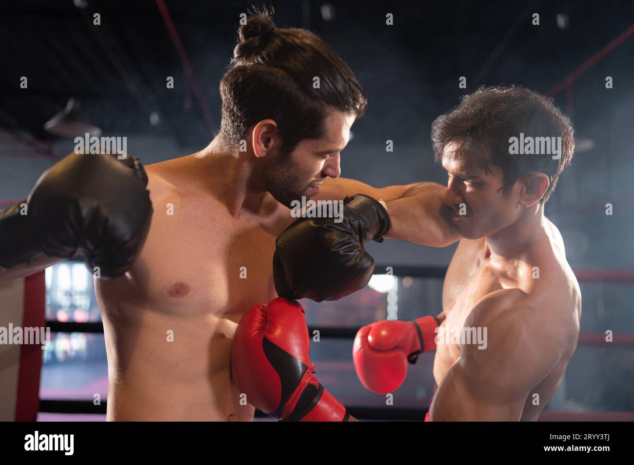 Using the elbow is one of the Muay Thai weapons that is used to chop into the head or face of an opponent to create a wound. whi Stock Photo