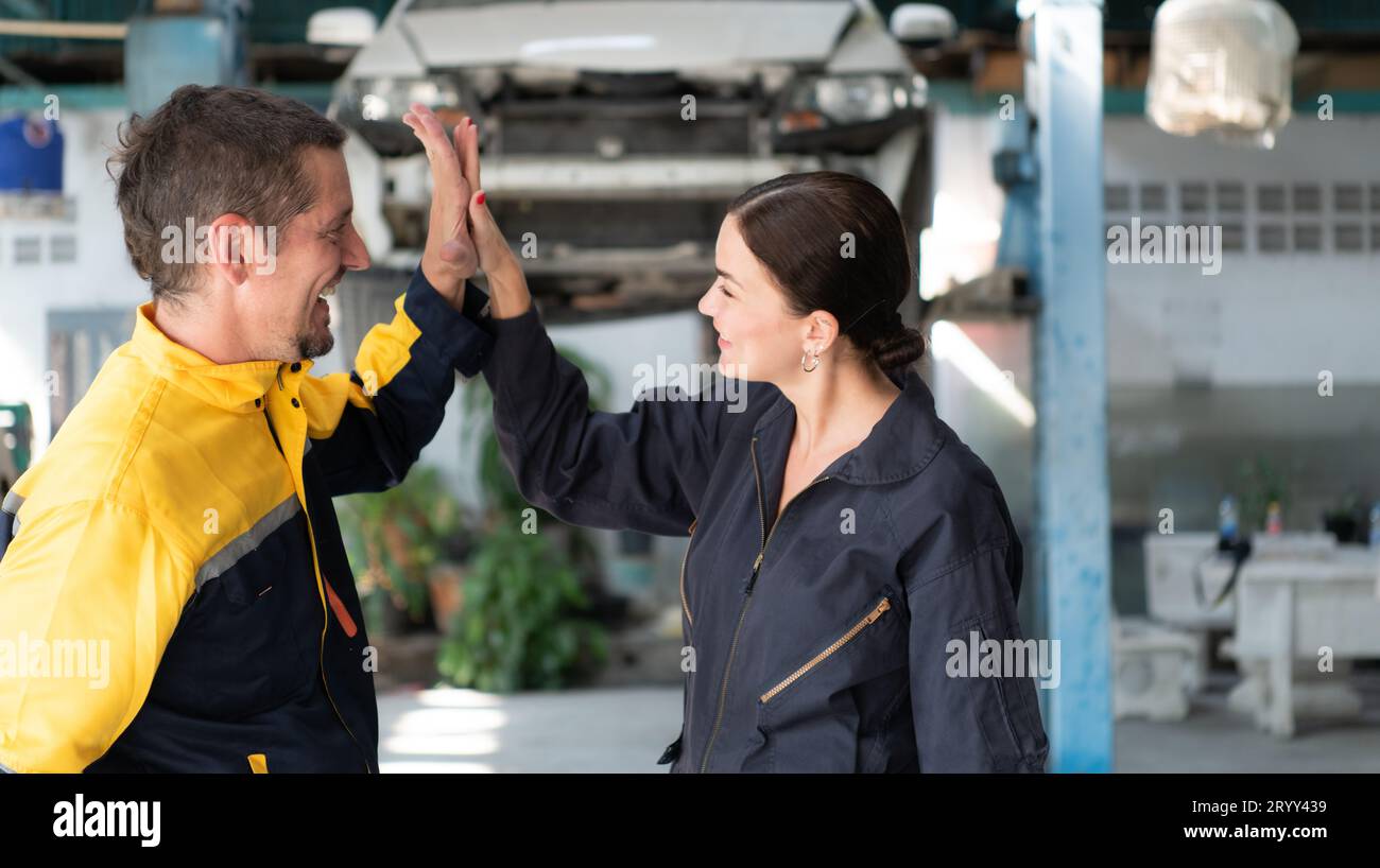 Portrait of engineer and auto mechanic with working on engine repairs