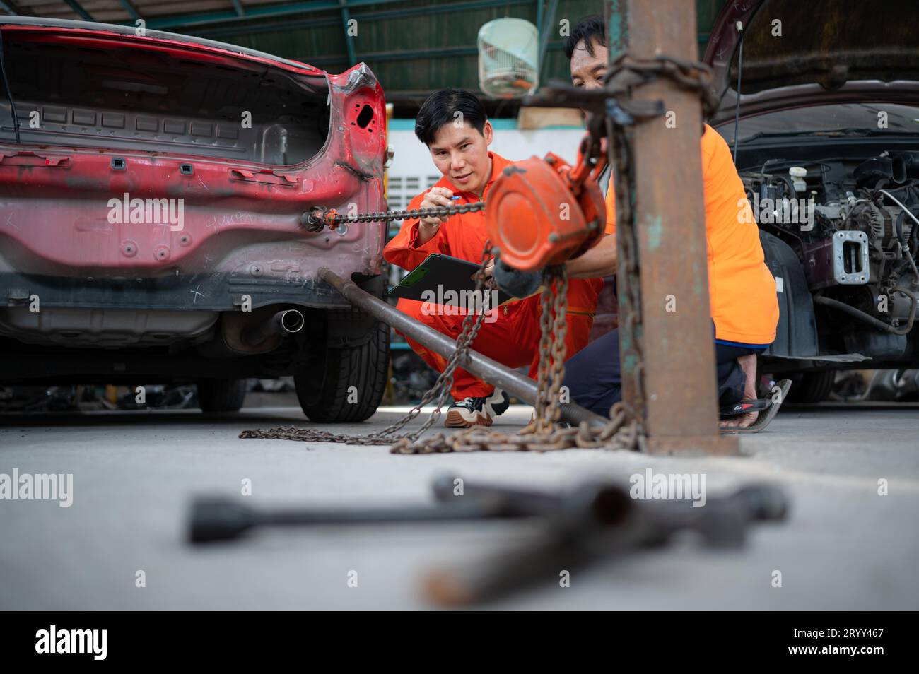 To return the automobile body to its former shape, an auto repair ...