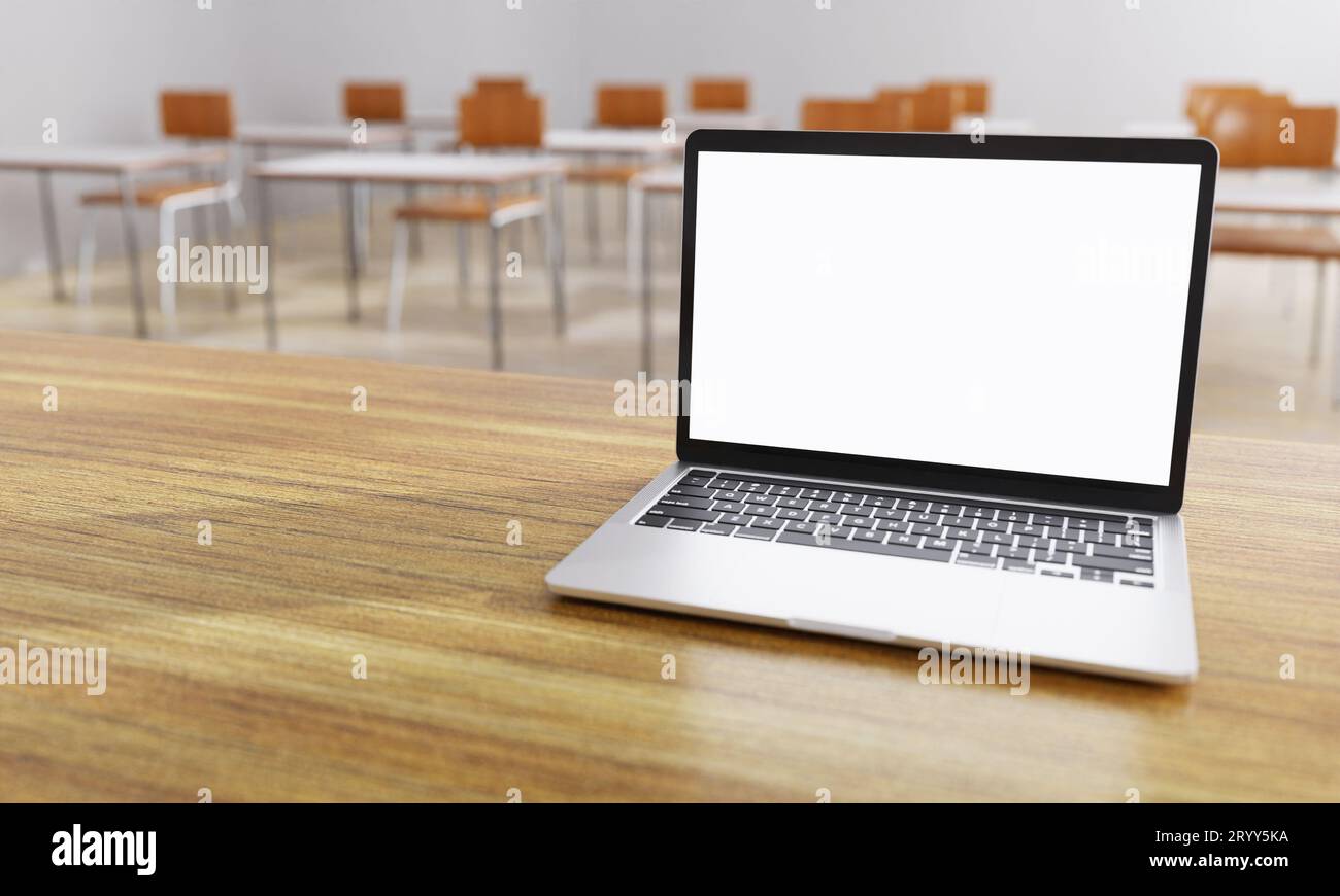 Close up of white isolated cut out laptop monitor display with classroom background. Education and telecommunication learning an Stock Photo