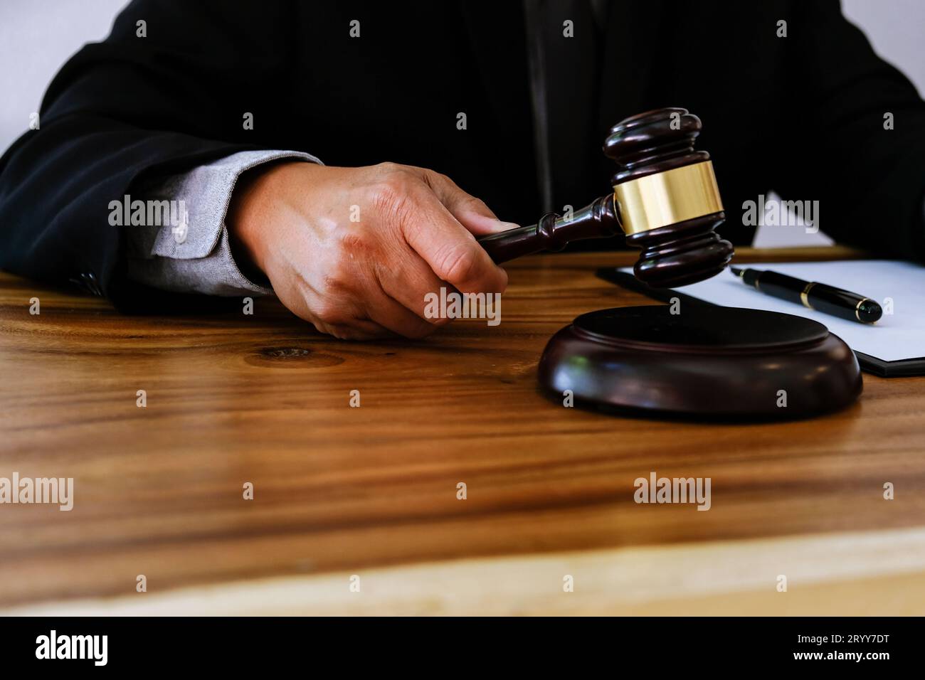 Lawyer Legal counsel presents to bid sale judgment mallet with judge