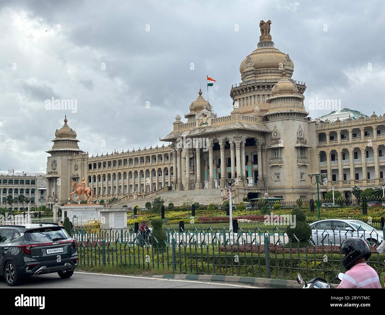 Exclusive day shots of Vidhana Soudha building with traffic on a overcast day Stock Photo