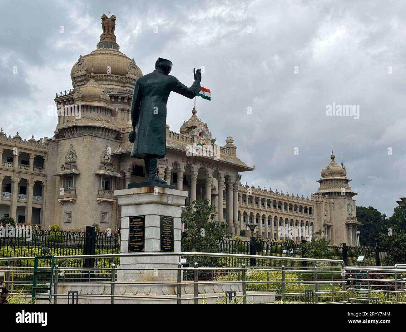 Exclusive day shots of Vidhana Soudha building with traffic on a overcast day Stock Photo