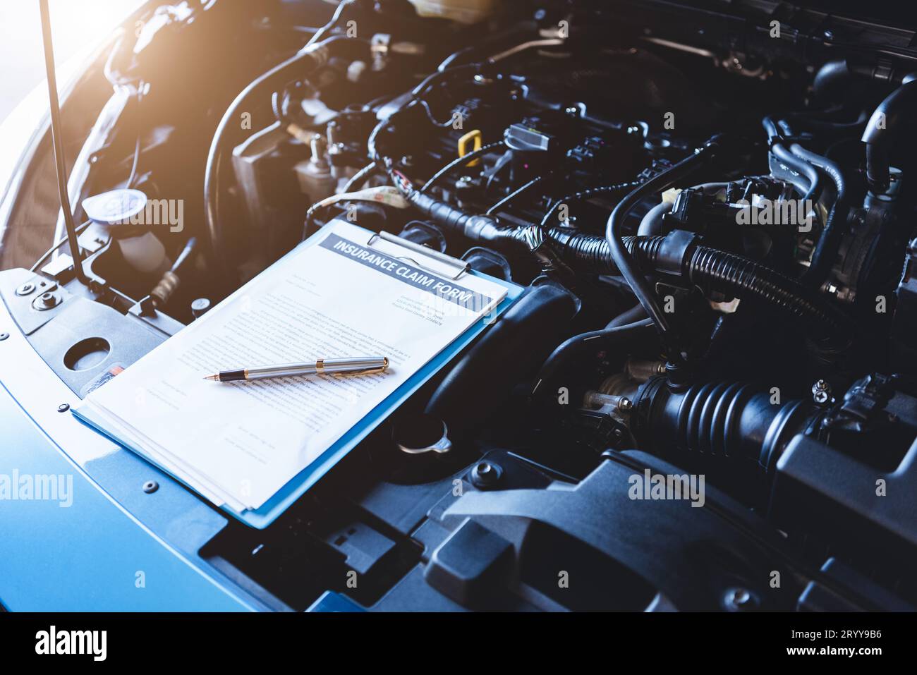 Clipboard on car with car insurance claim form for customer maintenance