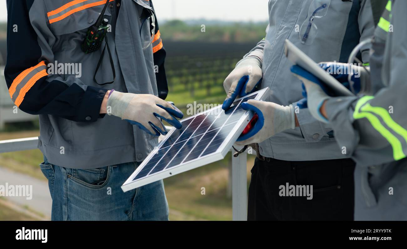 On the rooftop of a large solar energy storage station building, A team ...