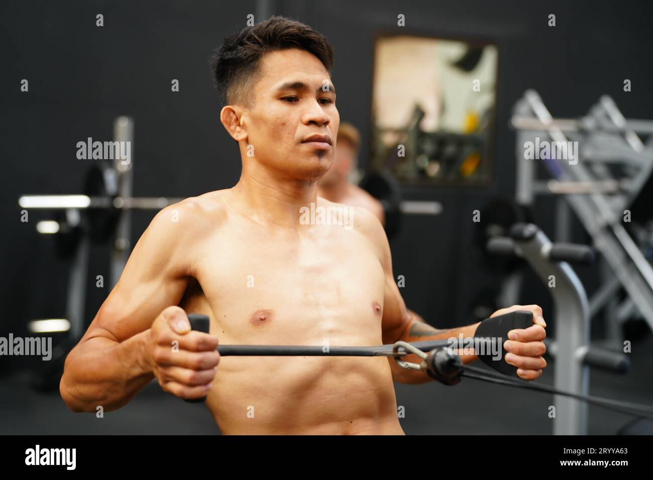 Mixed martial arts fighter going to the gym to build strong muscles To