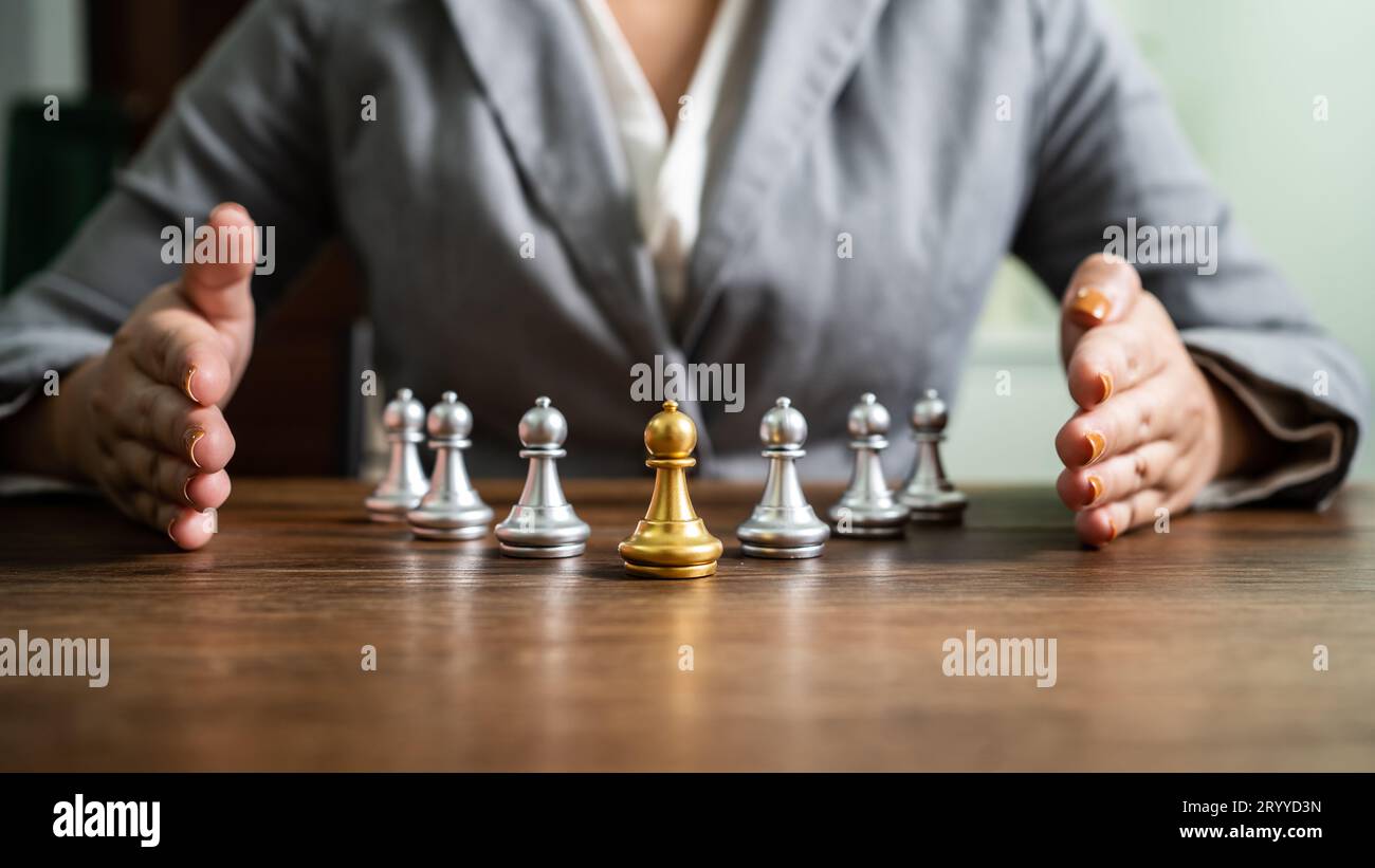 Chess leader and team. Human resources concept career management with clasped hands planning strategy with chess figures. leader Stock Photo