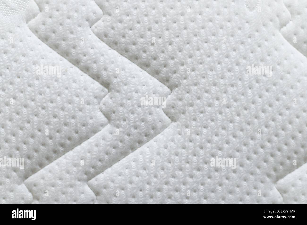 Closeup of white mattress texture background. Material and furniture concept. Comfortable soft couch bedding Stock Photo